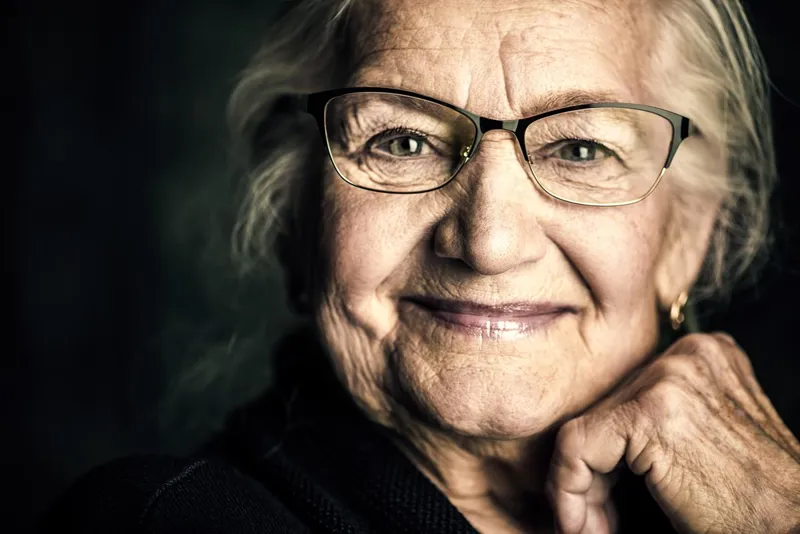Senior lady with glasses smiling