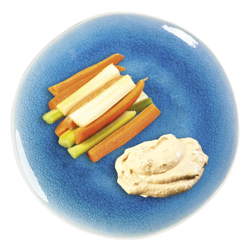 Carrot, celery and cheese sticks with houmous on a blue plate