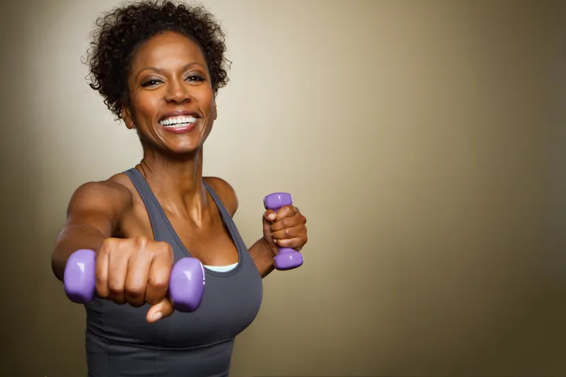 Our Communities - black-woman-with-weights (1)