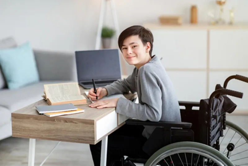 Wheelchair user with a laptop