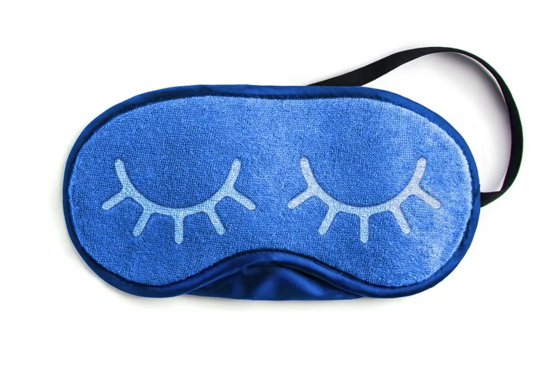 Blue sleep mask embroidered with closed eyes