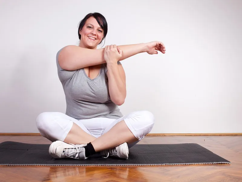 Woman stretching on a yoga mat