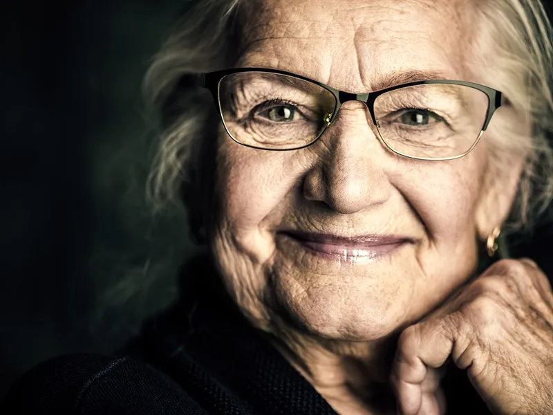 Smiling older woman wearing glasses