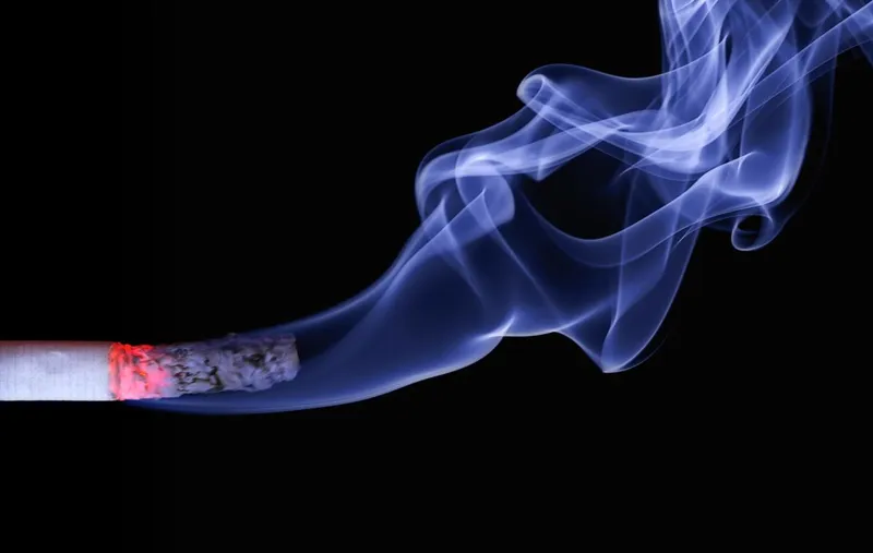 Ash falling from a burning cigarette