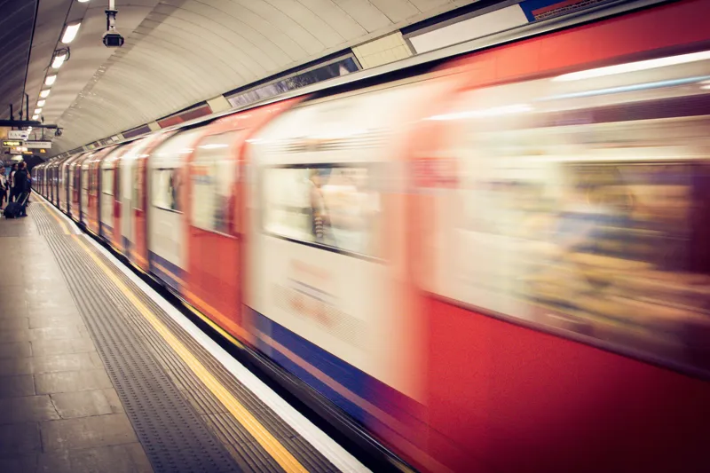 A London Underground train arriving at a station